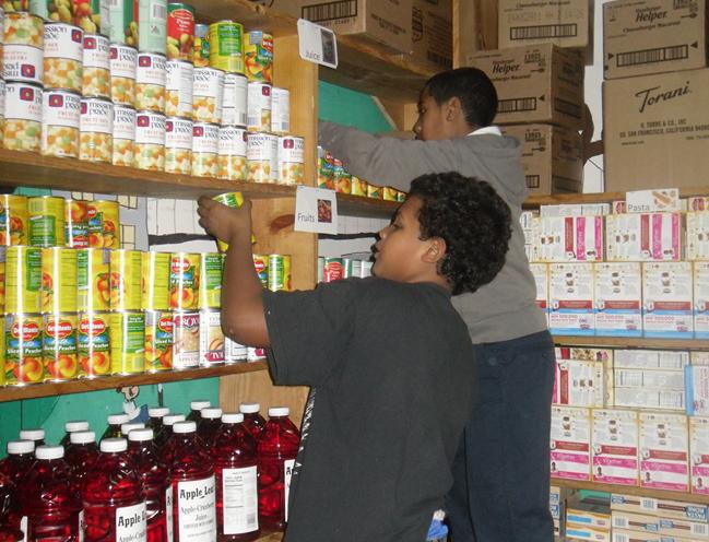 Fresh Youth Initiative participants stock the food pantry